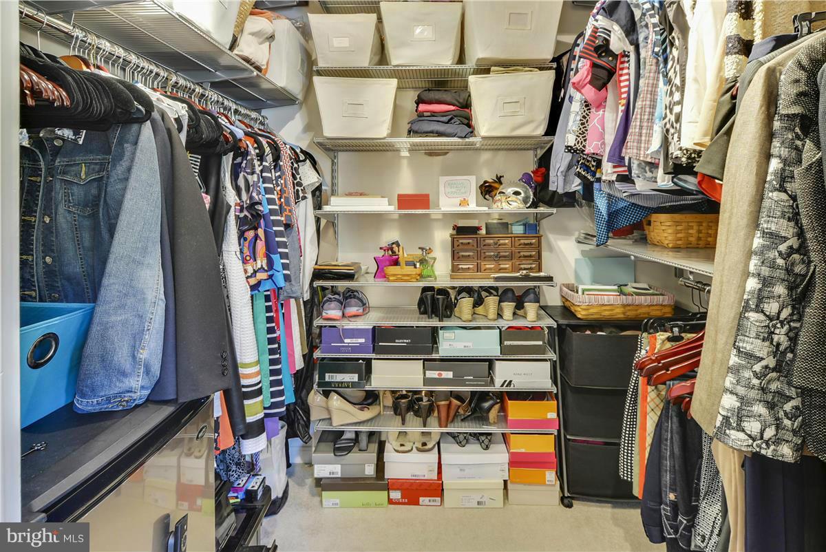 3873 Chain Bridge Road Fairfax, VA 22030 - Photo 17 of 29 a view of walk in closet with clothes and shoes
