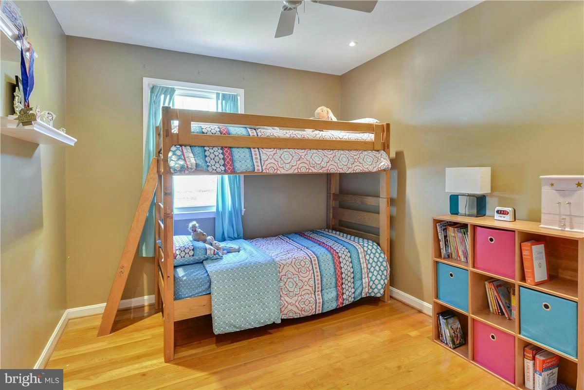 3873 Chain Bridge Road Fairfax, VA 22030 - Photo 18 of 29 a bedroom with a bed and a book shelf