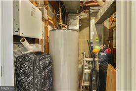 3873 Chain Bridge Road Fairfax, VA 22030 - Photo 24 of 29 a view of walk in closet with clothes