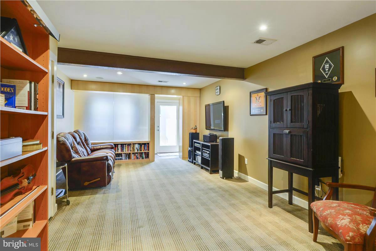 3873 Chain Bridge Road Fairfax, VA 22030 - Photo 9 of 29 a living room with furniture and a flat screen tv