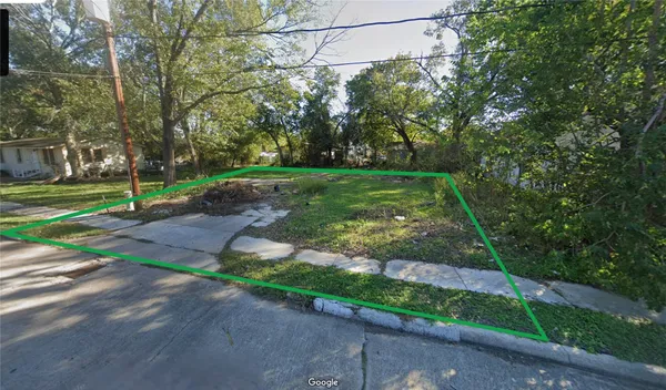 a view of a park with large trees