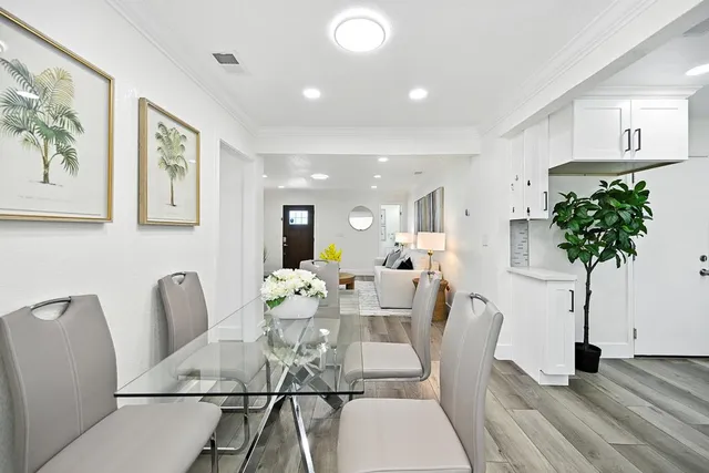 a dining room with furniture and window