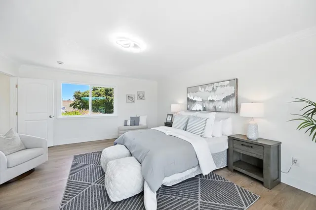 a bedroom with a bed and a couch