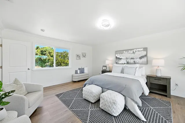 a bedroom with a bed and window