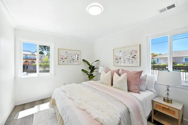 a bedroom with bed and a window