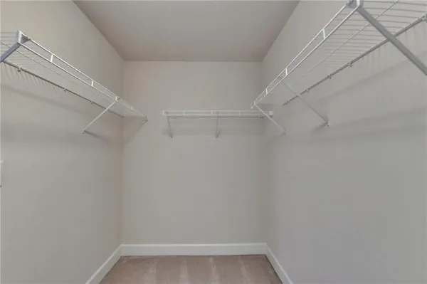 a bedroom with a bed and mirror