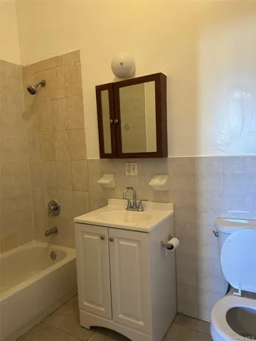 a bathroom with a sink toilet and tub