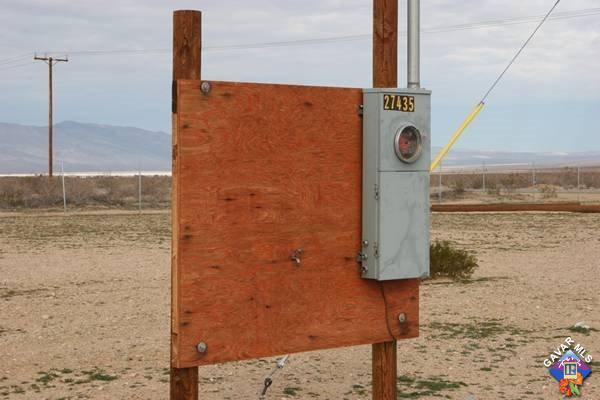 27435 Neuralia Road Mojave, CA 93501 - Photo 9 of 12 a blue sign board with a shower