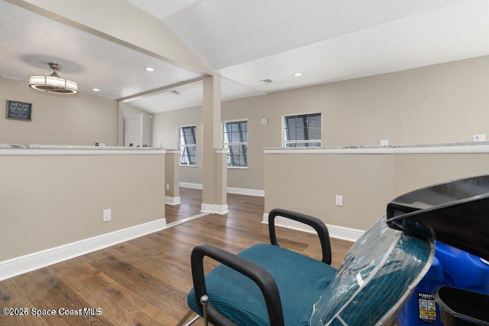 1280 Highway 1, Unit B Malabar, FL 32950 - Photo 11 of 26 a living room with furniture and kitchen view