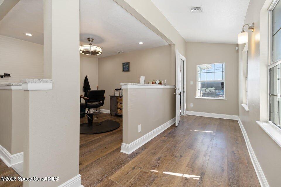 1280 Highway 1, Unit B Malabar, FL 32950 - Photo 12 of 26 a view of a livingroom with furniture wooden floor and a window