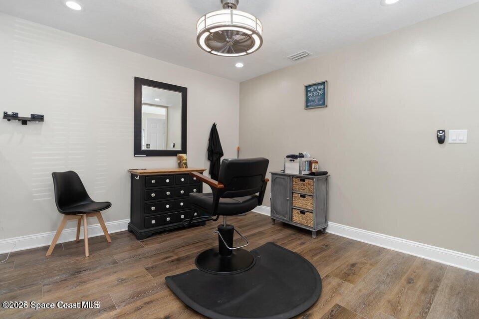 1280 Highway 1, Unit B Malabar, FL 32950 - Photo 13 of 26 a view of a workspace with furniture and a rug