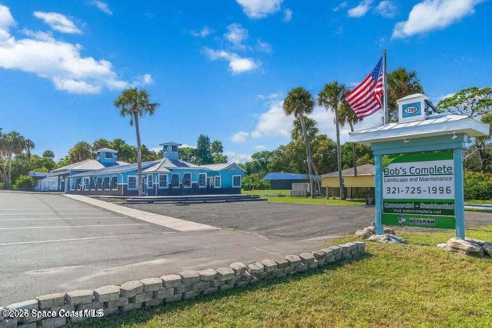 1280 Highway 1, Unit B Malabar, FL 32950 - Photo 2 of 26 a view of a street with a building and a street sign