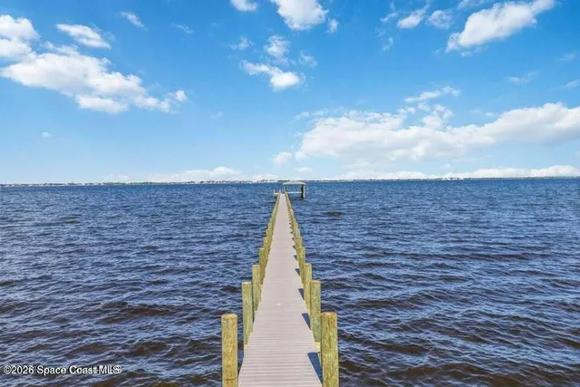 a balcony with view of the ocean
