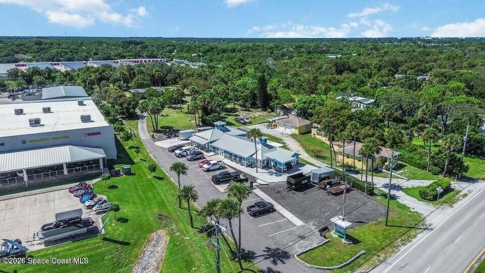 1280 Highway 1, Unit B Malabar, FL 32950 - Photo 4 of 26 an aerial view of multiple houses with yard