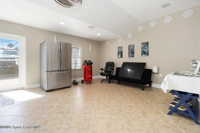 a livingroom with furniture and a flat screen tv