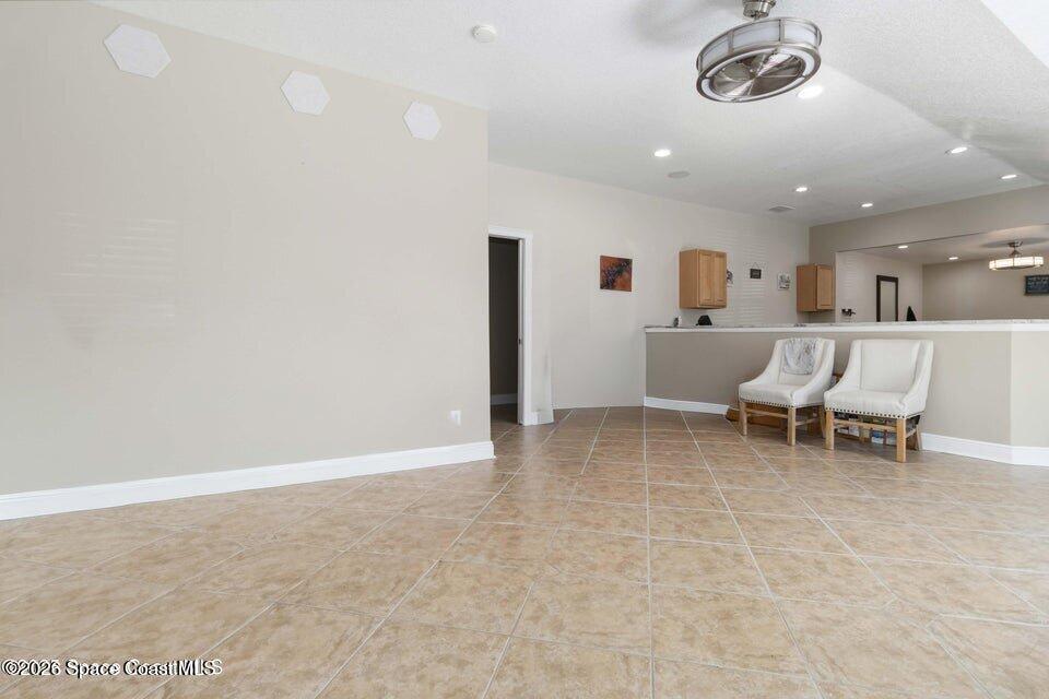 1280 Highway 1, Unit B Malabar, FL 32950 - Photo 9 of 26 a view of a room with furniture and a chandelier
