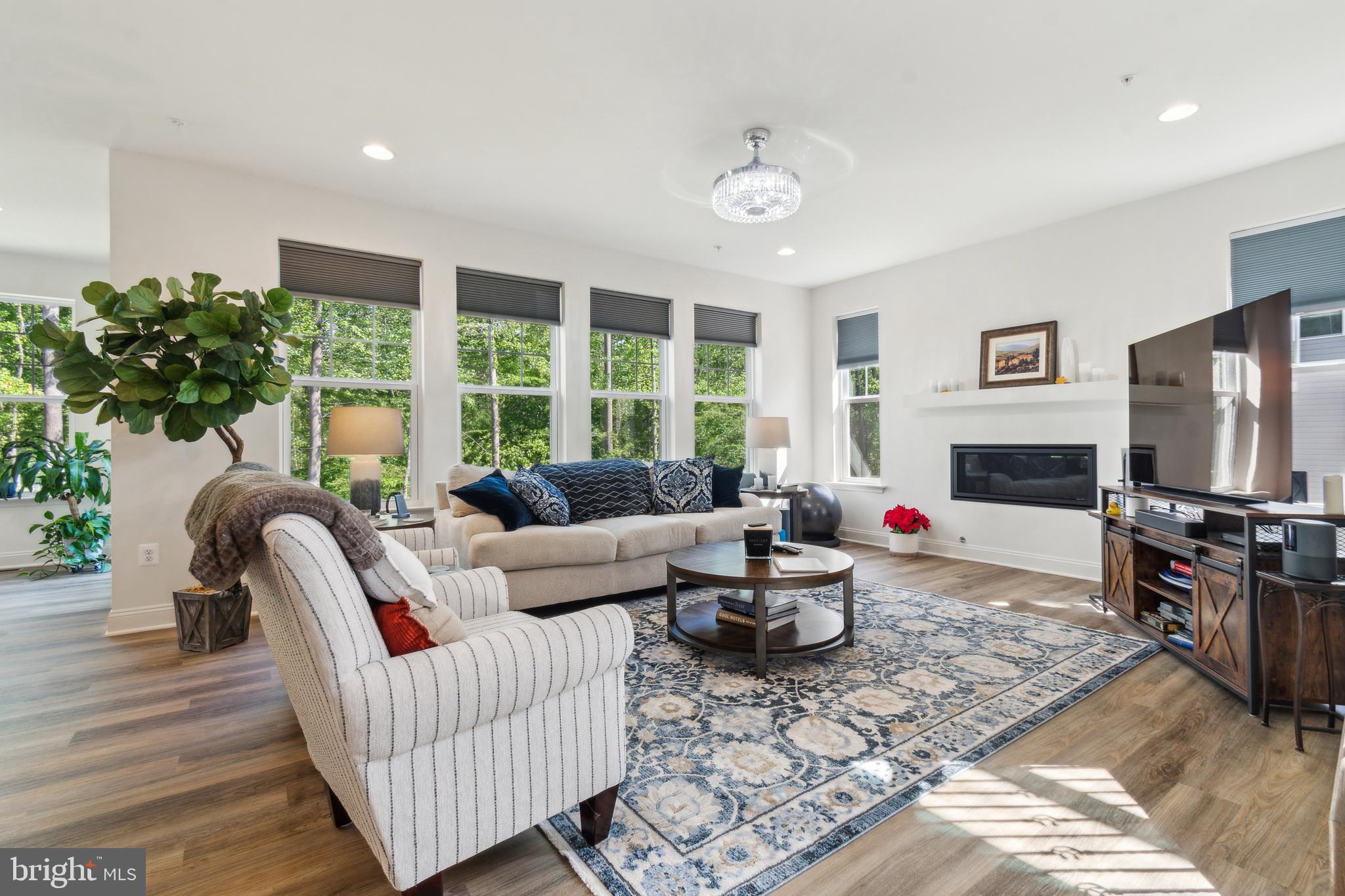 8604 Cedar Chase Drive Clinton, MD 20735 - Photo 12 of 68 a living room with furniture fireplace and flat screen tv