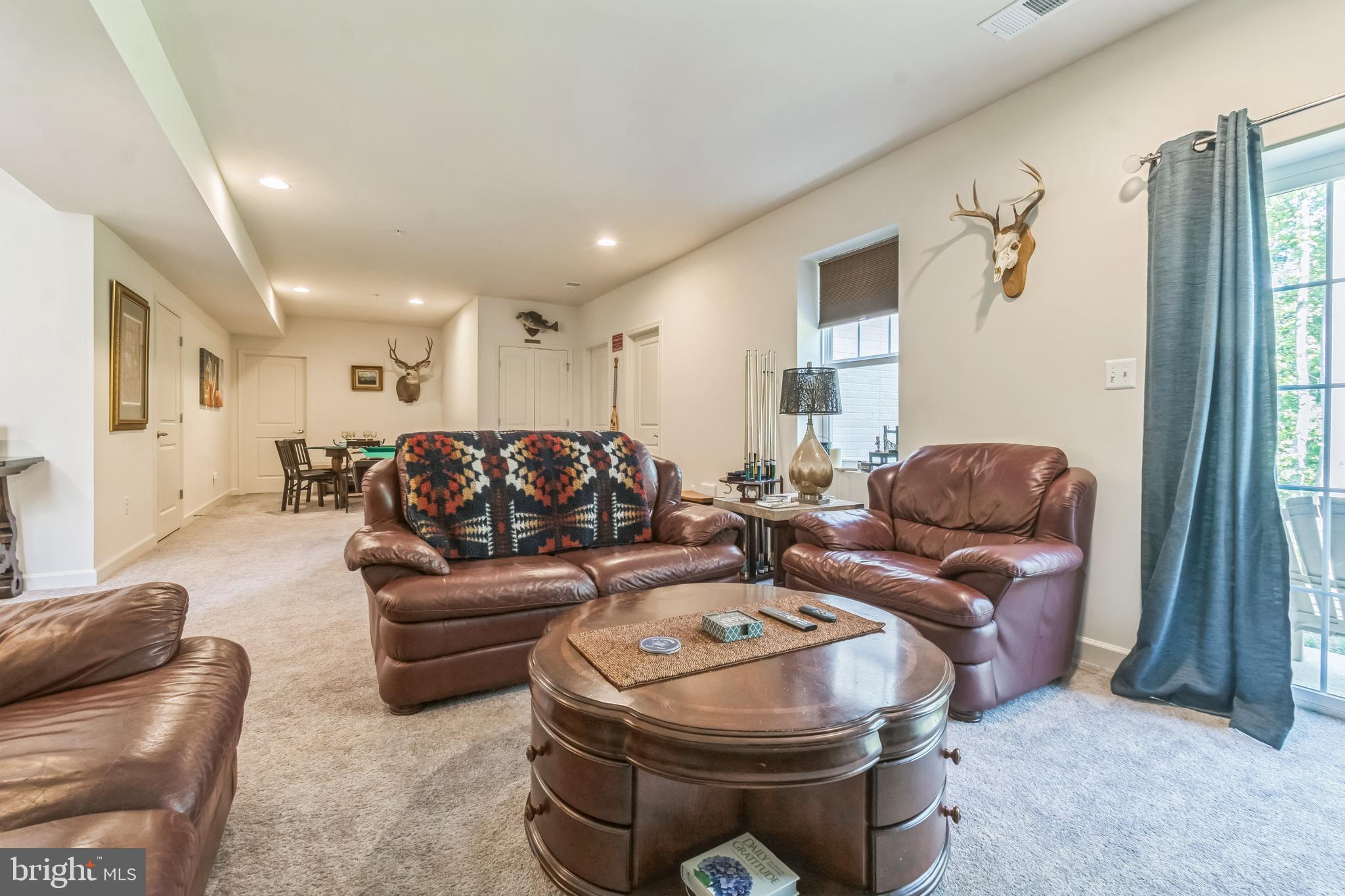 8604 Cedar Chase Drive Clinton, MD 20735 - Photo 13 of 68 a living room with furniture and a fireplace