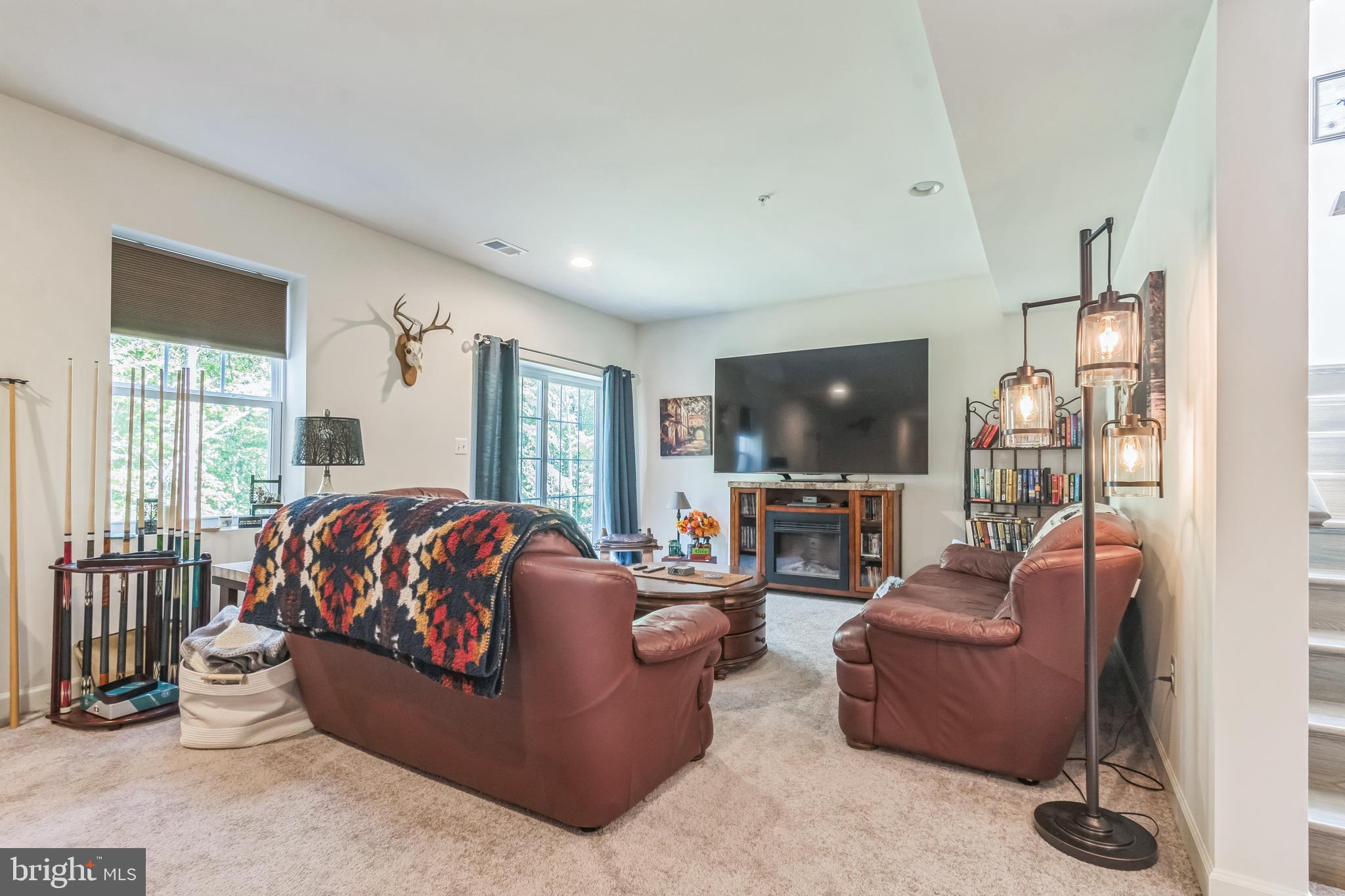 8604 Cedar Chase Drive Clinton, MD 20735 - Photo 15 of 68 a living room with furniture and a flat screen tv