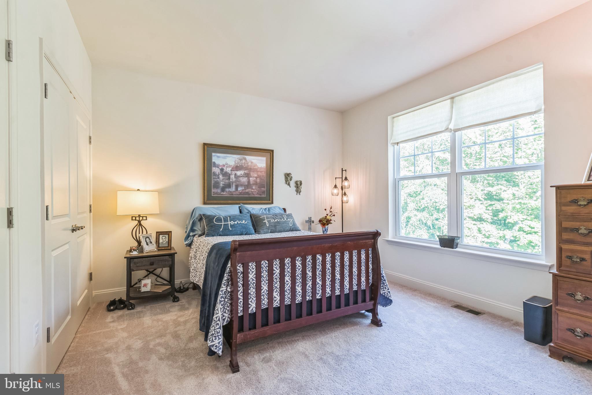 8604 Cedar Chase Drive Clinton, MD 20735 - Photo 23 of 68 a bed sitting in a bedroom next to a window
