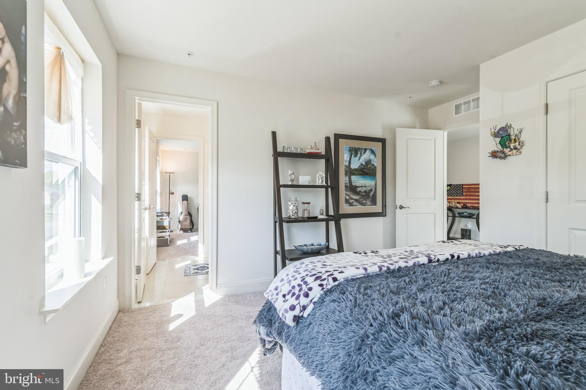8604 Cedar Chase Drive Clinton, MD 20735 - Photo 26 of 68 a bedroom with a large bed and a window