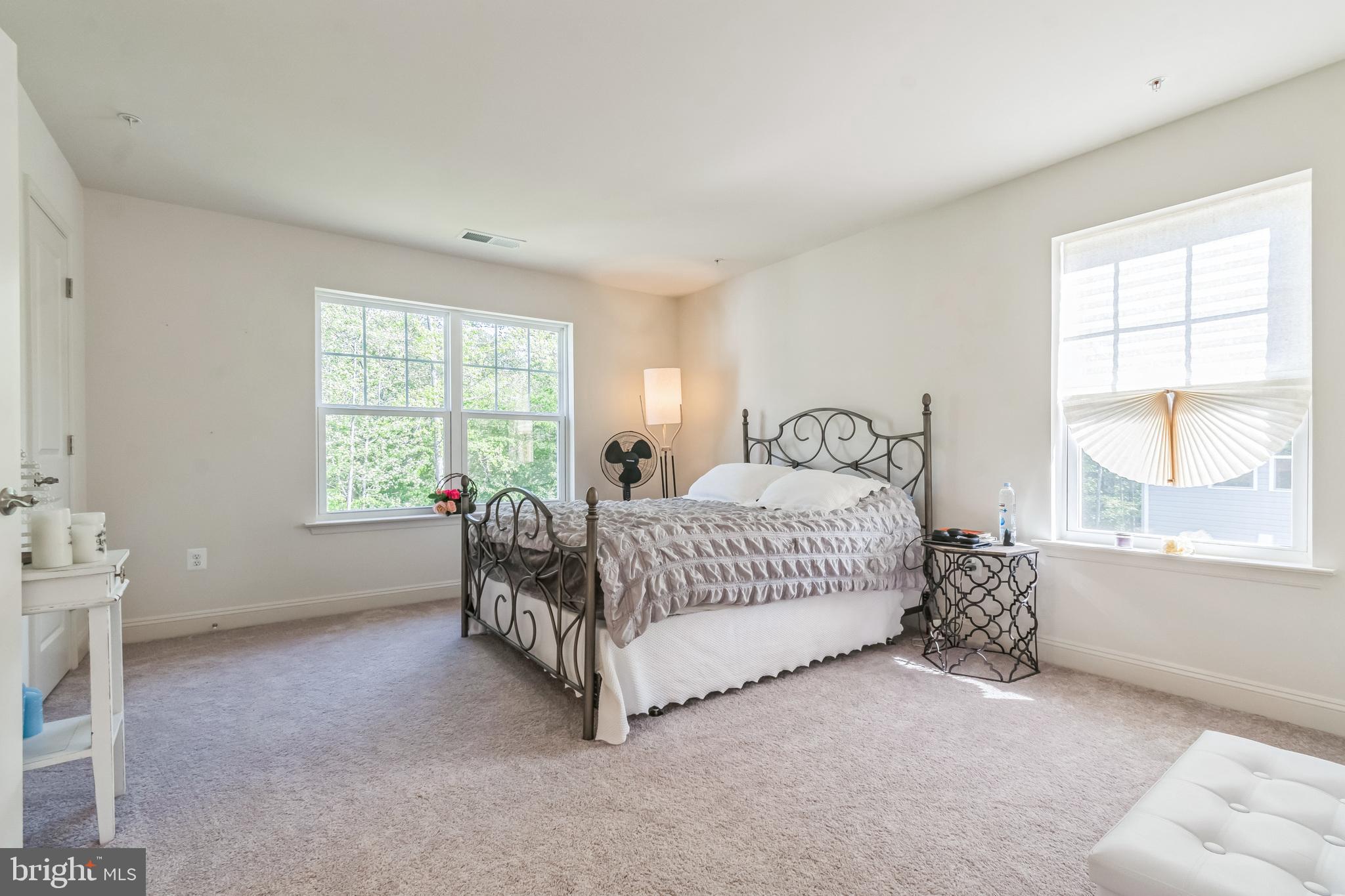 8604 Cedar Chase Drive Clinton, MD 20735 - Photo 27 of 68 a spacious bedroom with a bed and a window
