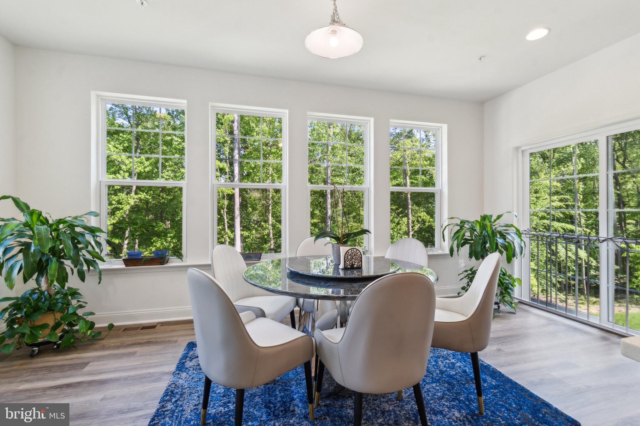 8604 Cedar Chase Drive Clinton, MD 20735 - Photo 3 of 68 a view of a dining room with furniture window and wooden floor