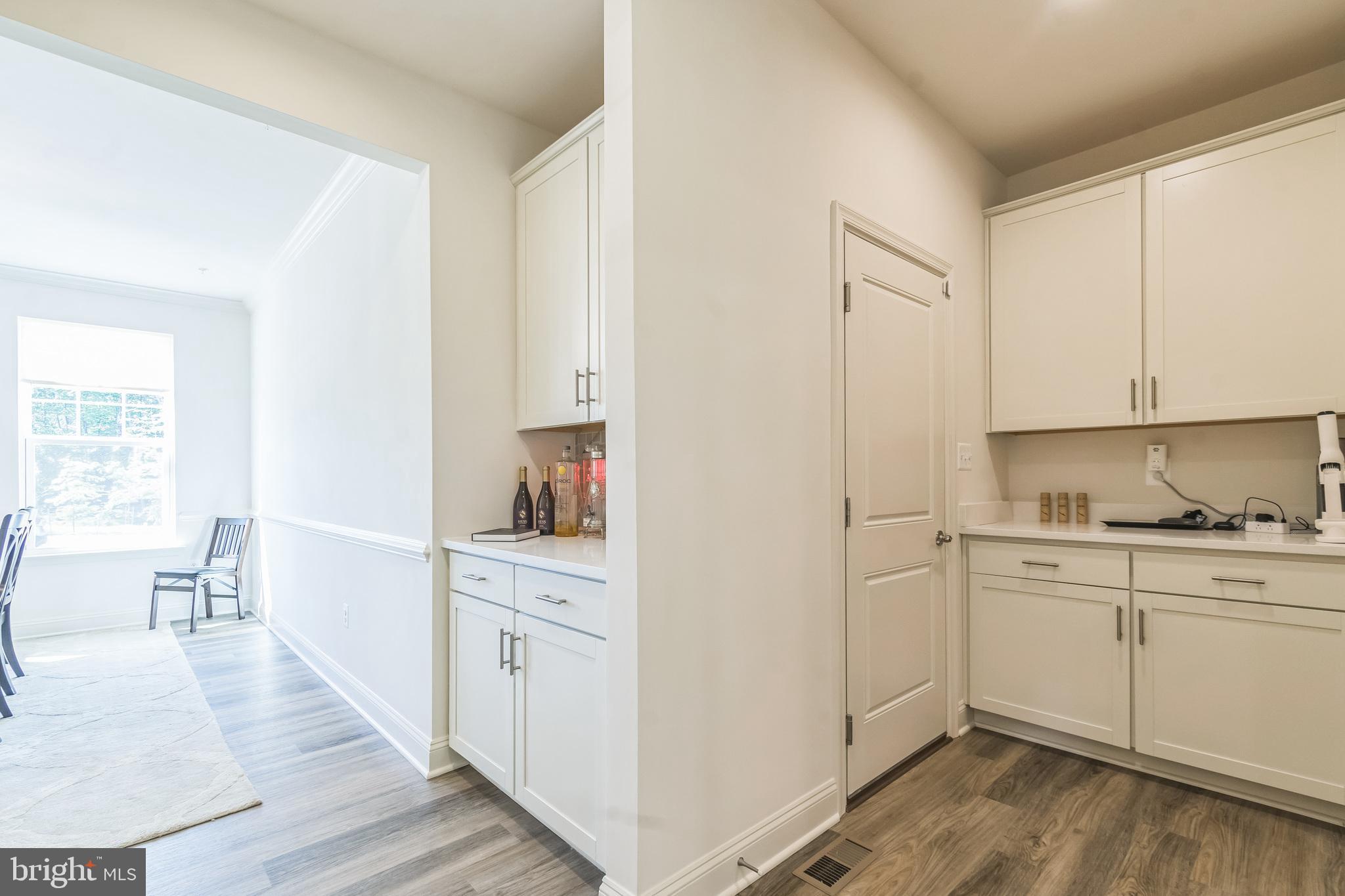 8604 Cedar Chase Drive Clinton, MD 20735 - Photo 37 of 68 a kitchen with white cabinets and sink