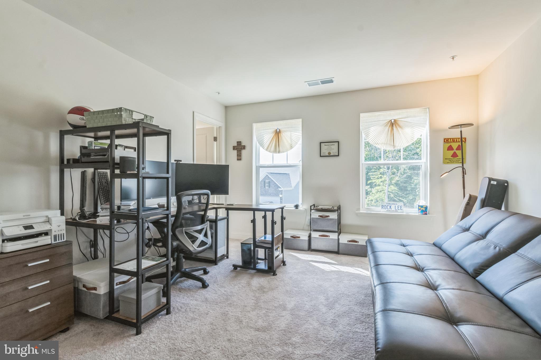8604 Cedar Chase Drive Clinton, MD 20735 - Photo 46 of 68 a living room with furniture a flat screen tv and a window