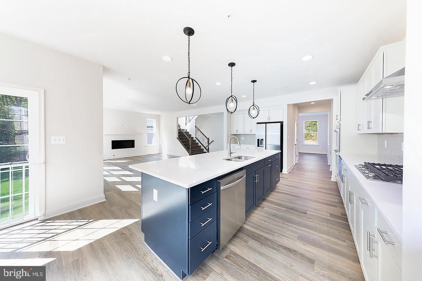 8604 Cedar Chase Drive Clinton, MD 20735 - Photo 60 of 68 a large kitchen with stainless steel appliances lots of counter space and wooden floor