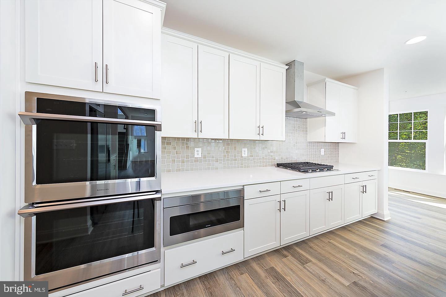 8604 Cedar Chase Drive Clinton, MD 20735 - Photo 61 of 68 a kitchen with granite countertop white cabinets and stainless steel appliances