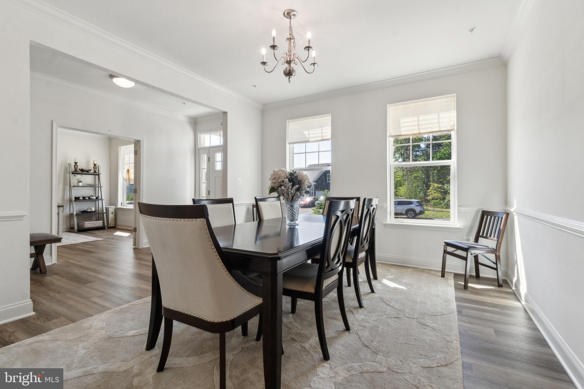 8604 Cedar Chase Drive Clinton, MD 20735 - Photo 8 of 68 a view of a dining room with furniture and wooden floor