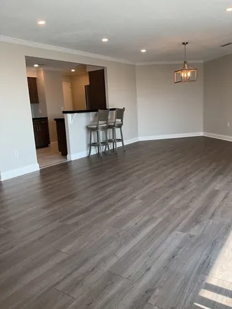 a view of kitchen with cabinets and wooden floor