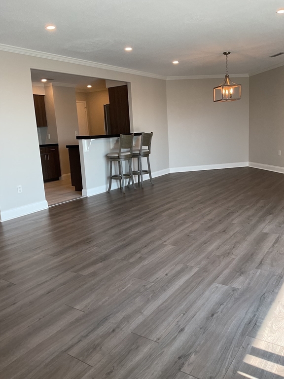1006 Paradise Road, Unit PH Q Swampscott, MA 01907 - Photo 3 of 16 a view of kitchen with cabinets and wooden floor