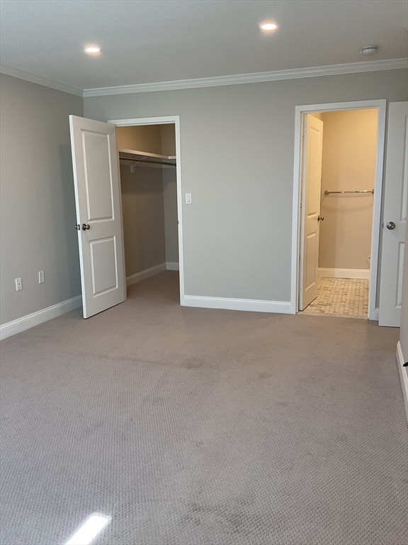 1006 Paradise Road, Unit PH Q Swampscott, MA 01907 - Photo 8 of 16 an empty room with windows and closet