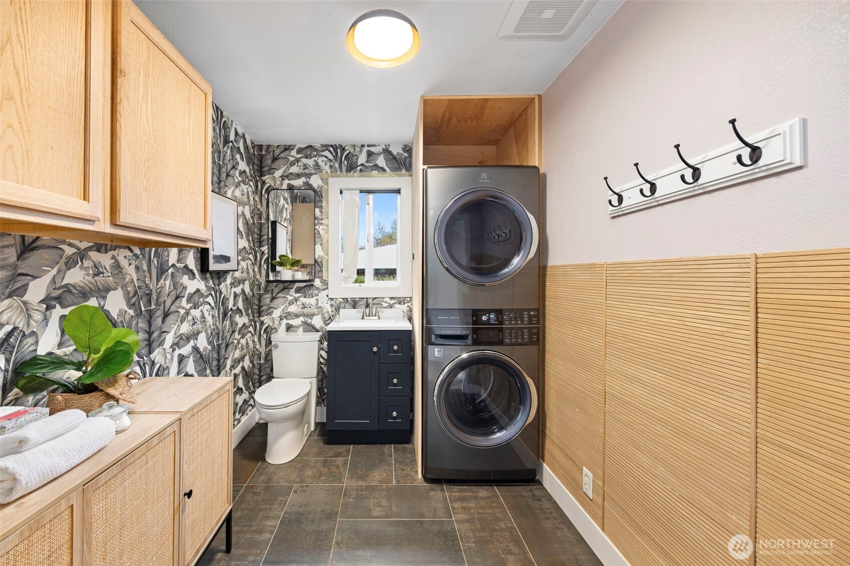 7813 46th Avenue South Seattle, WA 98118 - Photo 12 of 18 a view of a kitchen with a washer and dryer