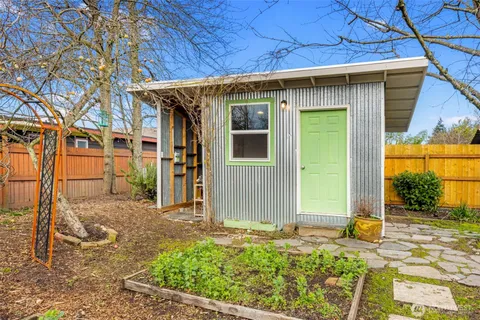 a front view of a house with a small yard
