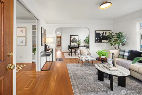 a living room with furniture and a table