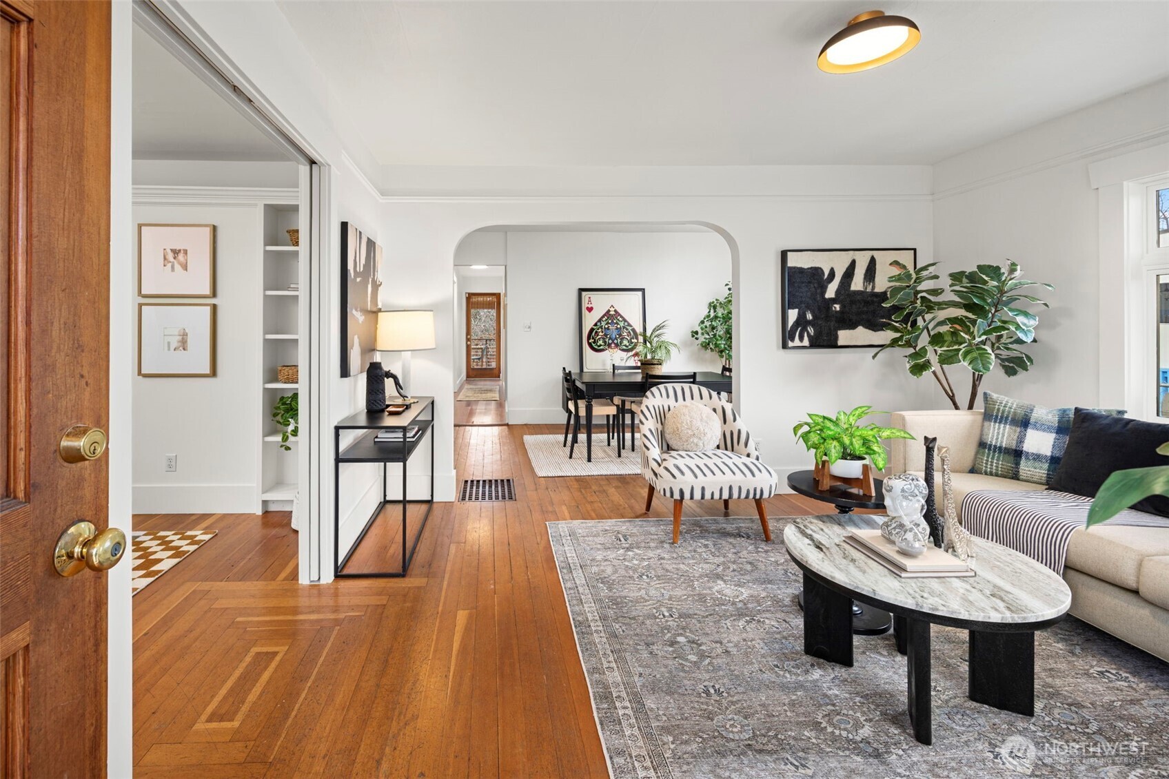 7813 46th Avenue South Seattle, WA 98118 - Photo 2 of 18 a living room with furniture and a table