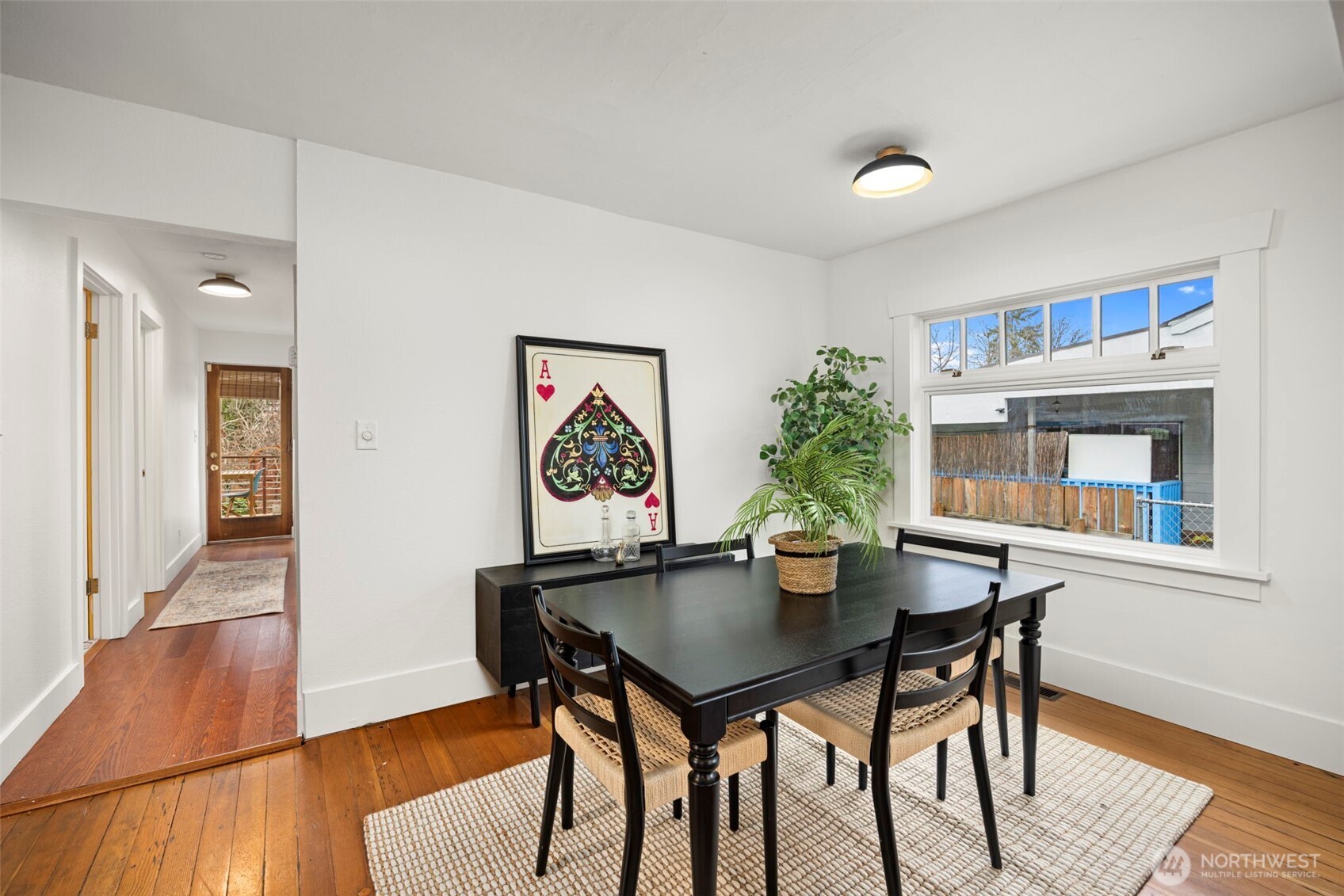 7813 46th Avenue South Seattle, WA 98118 - Photo 6 of 18 a view of a dining room with furniture and wooden floor