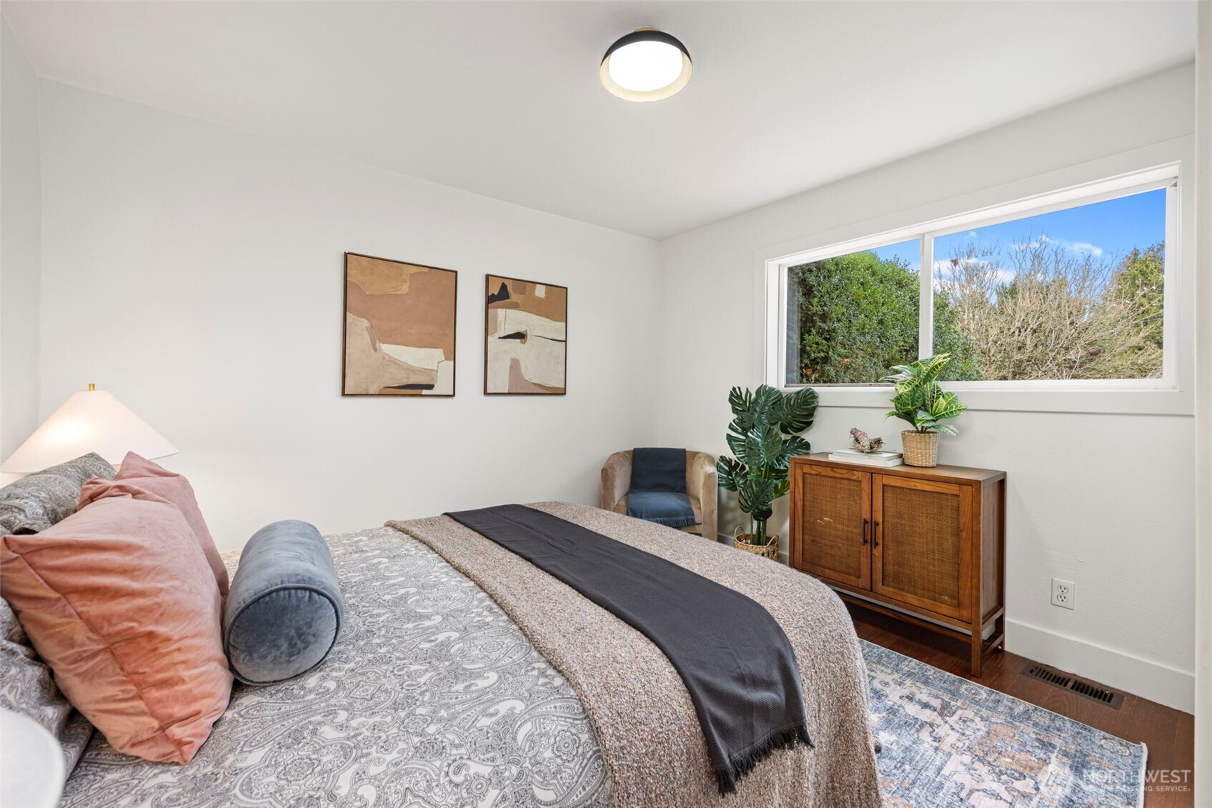 7813 46th Avenue South Seattle, WA 98118 - Photo 9 of 18 a bedroom with a bed and a dresser
