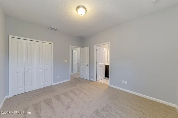 a bathroom with a sink a toilet a mirror and shower