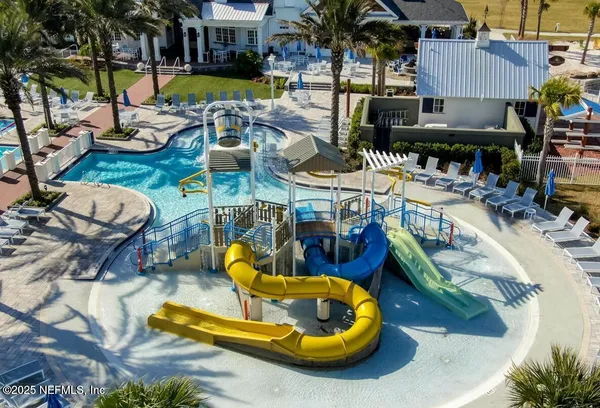 an aerial view of a house with swimming pool