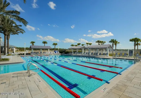 a living room with furniture kitchen view and a table