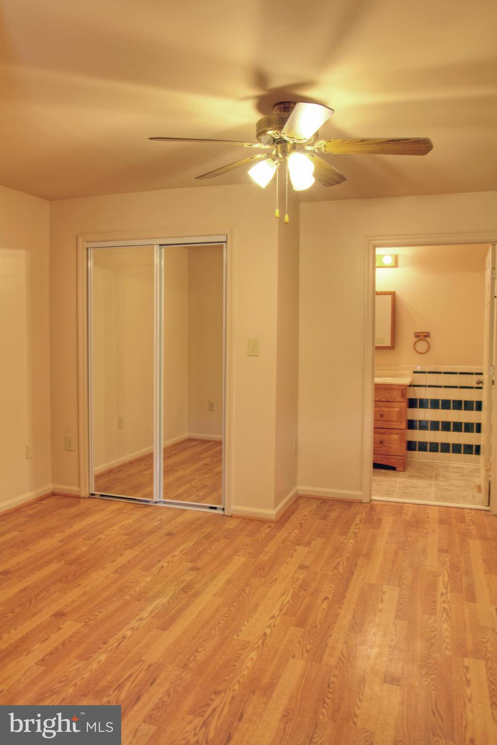 3705 Collier Road Randallstown, MD 21133 - Photo 14 of 30 a view of an empty room with a chandelier fan