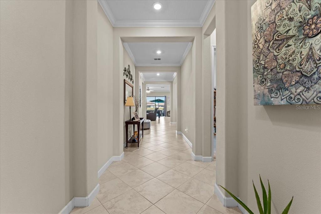 13443 White Sapphire Road Riverview, FL 33579 - Photo 13 of 47 a view of a hallway with wooden shelves