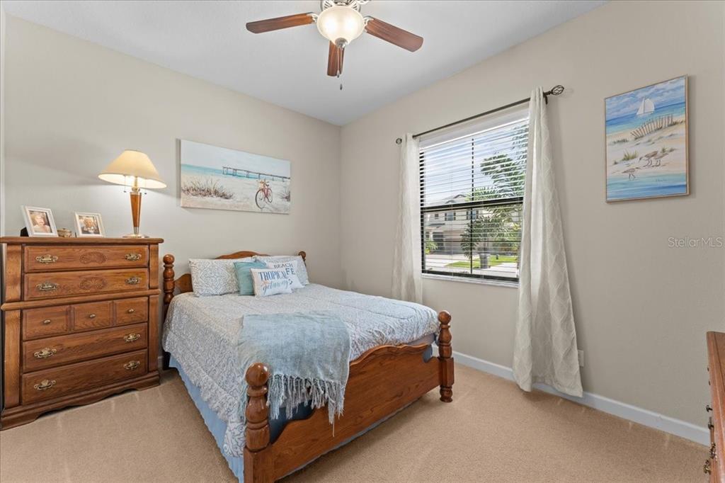13443 White Sapphire Road Riverview, FL 33579 - Photo 23 of 47 a bedroom with a bed and a window