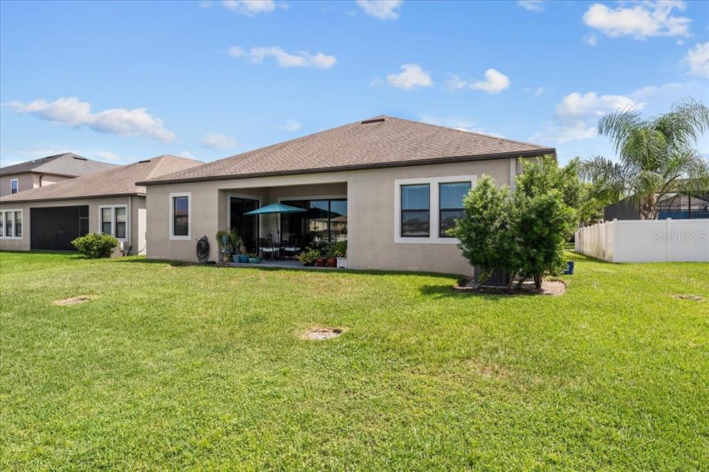 13443 White Sapphire Road Riverview, FL 33579 - Photo 32 of 47 a front view of a house with a yard and garage
