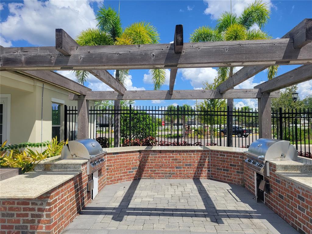 13443 White Sapphire Road Riverview, FL 33579 - Photo 39 of 47 a view of balcony with wooden floor and outdoor seating