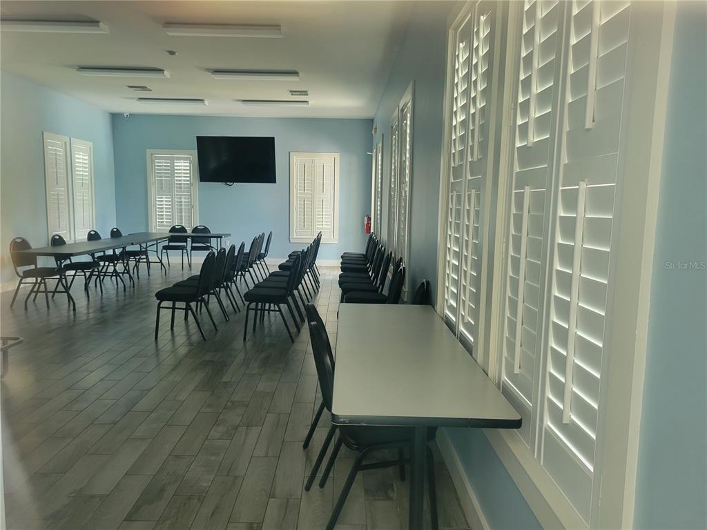 13443 White Sapphire Road Riverview, FL 33579 - Photo 40 of 47 a dining room with furniture and wooden floor